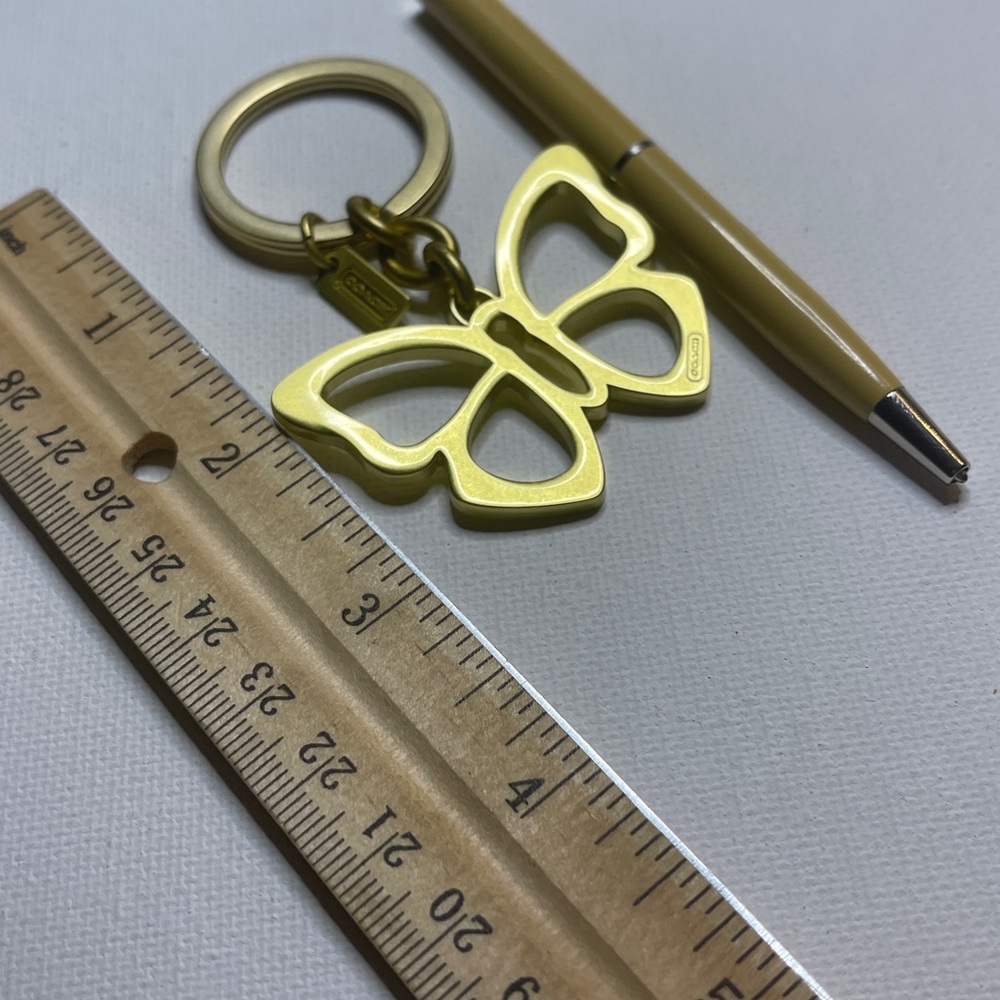 Coach Gold Butterfly Keychain and Cream Coach Pen - Picture 5 of 5